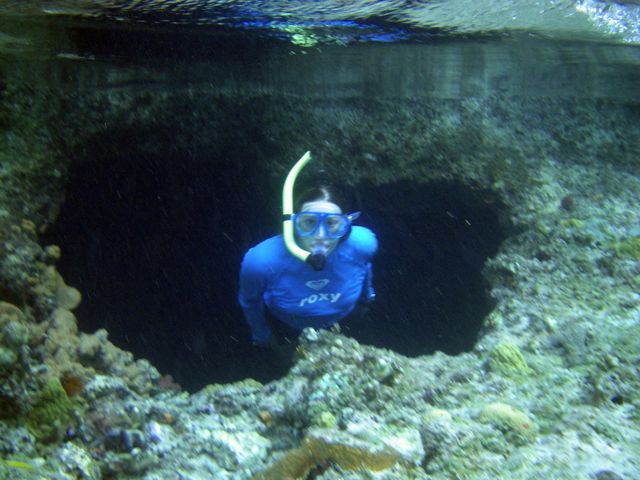 Heather emerging from Thunderball Cave