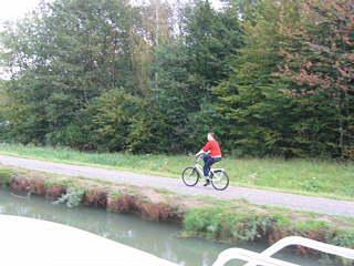 Heather riding ahead to the next lock