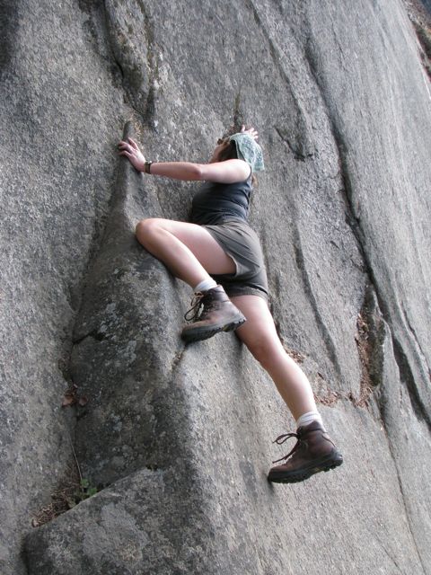 Heather not quite rock climbing